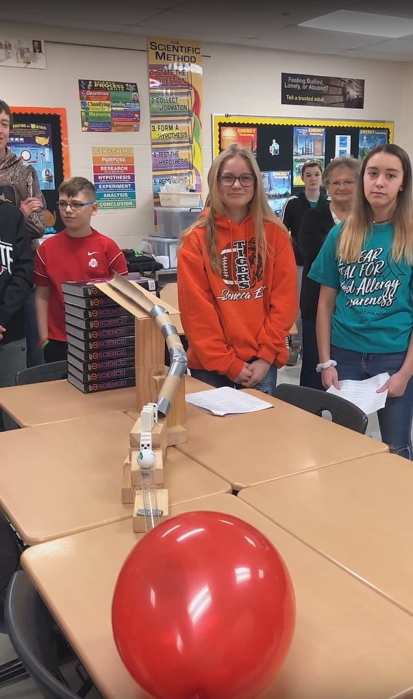 Student presenting Rube Goldberg machine